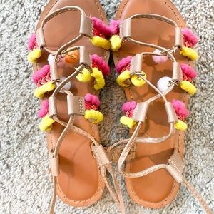 Pink and yellow pom-pom gladiator sandals